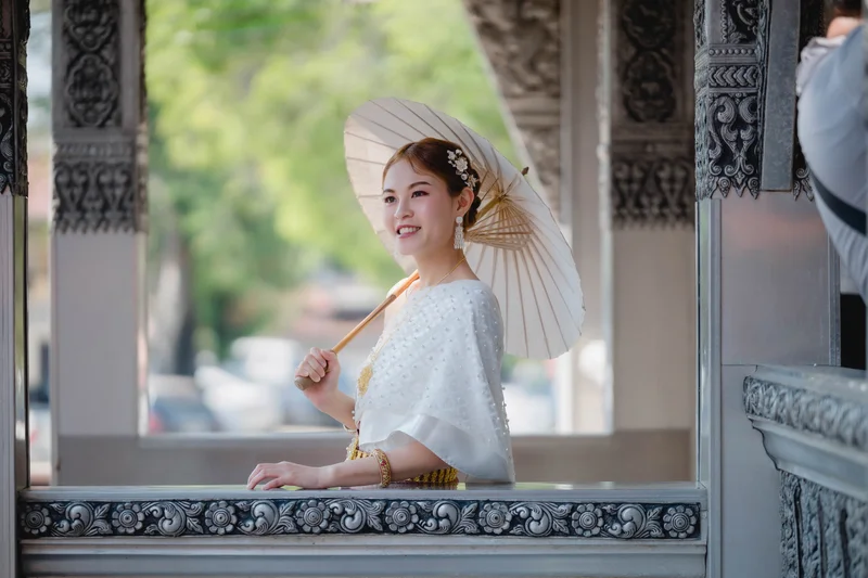 Four women in colorful Thai Sabai dresses at temple — Sabai Thai Dressing