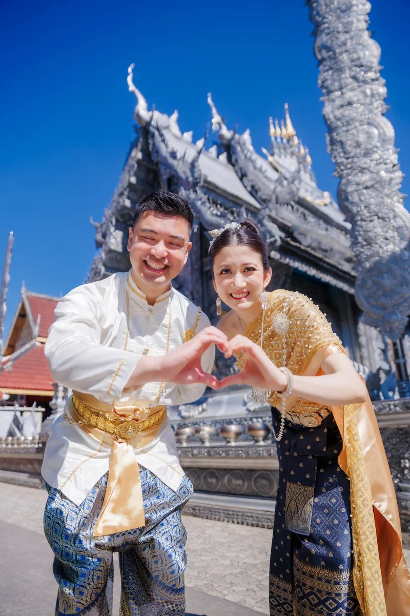 Man in traditional Thai costume at temple — romantic couple photoshoot