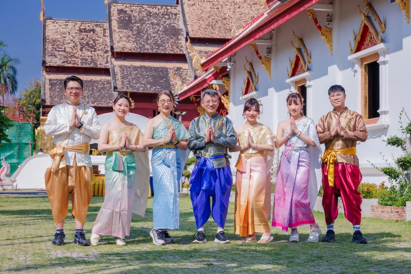 Men in coordinated Thai traditional attire — group booking