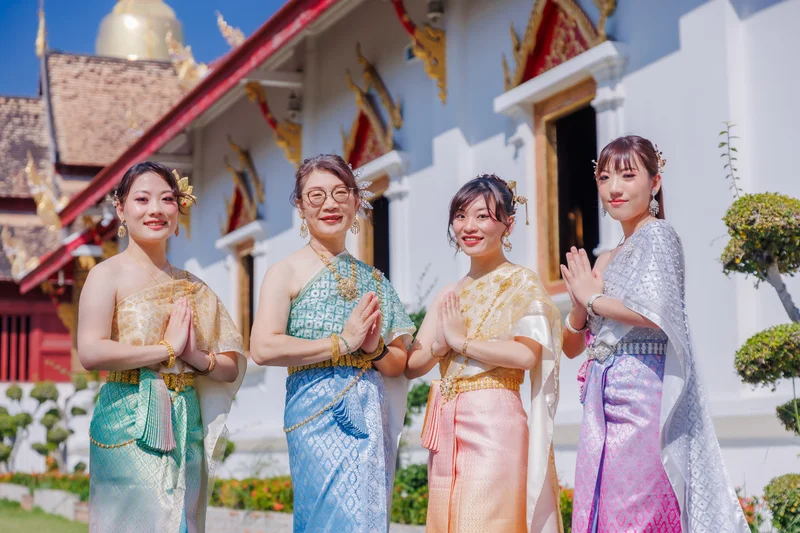 Three men in Thai costume at temple — Sabai Thai Dressing