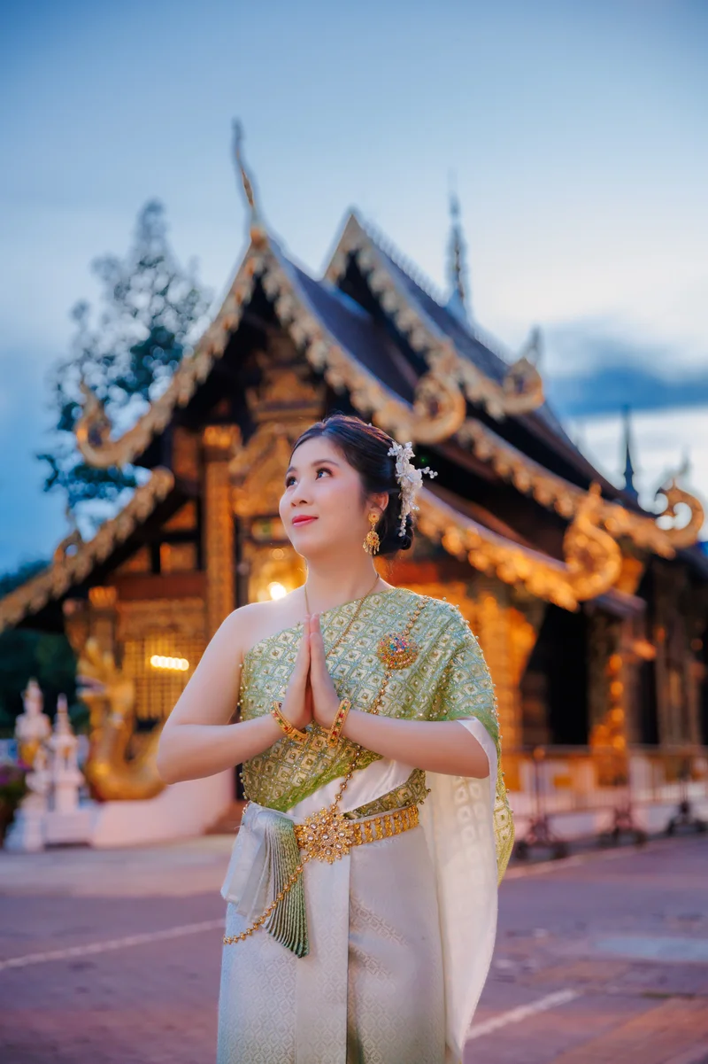 Customer in premium Thai silk at temple — Sabai Thai Dressing