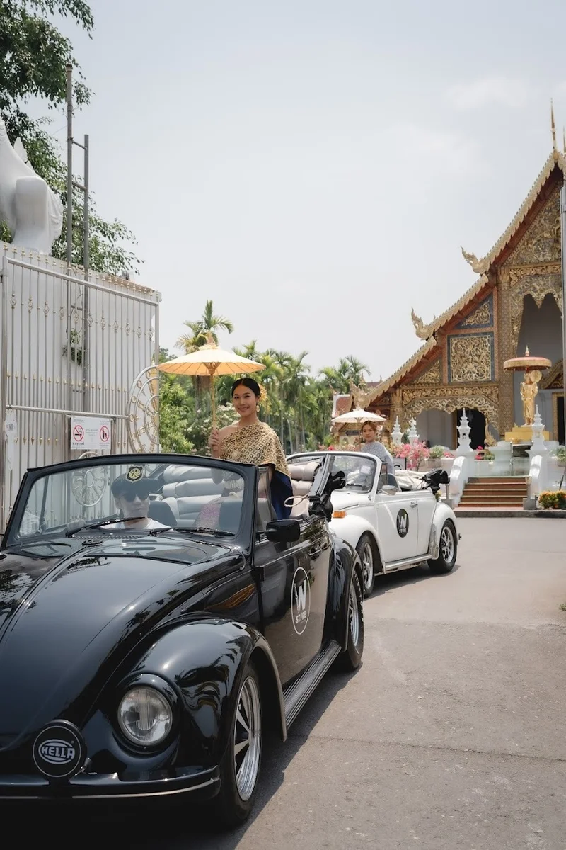 Thai dress photoshoot with vintage car and temple backdrop